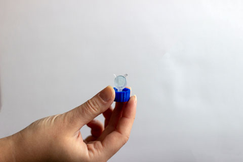 Person holding ortho-k lens